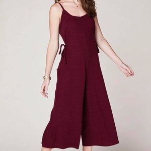 Maroon overall suit.